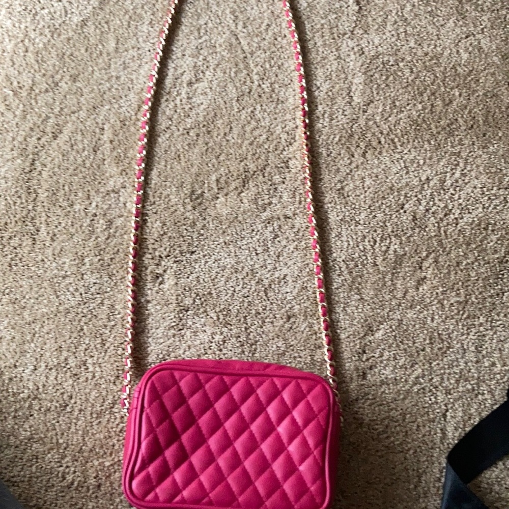 Hot pink crossbody purse.